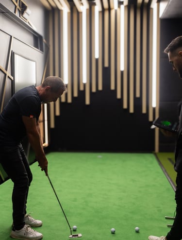an indoor golf simulator venue with a Zen putting stage