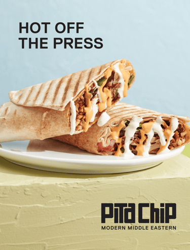 A promotional poster depicting a shawarma wrap and text that says "Hot Off the Press"