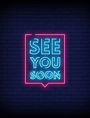 a neon - lit neon sign that says see you soon