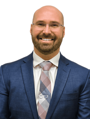 man wearing a suit and tie with glasses on