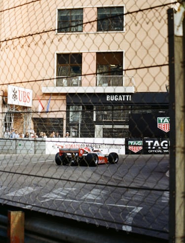 80's Formula 1 car going through La Rascasse corner in Monaco