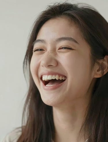 A close-up photograph of a 15-year-old girl laughing spontaneously, focusing on genuine emotion. Soft, cinematic lighting with a color palette of #E0DCD9 and #3D3A38. Minimalist and professional composition.