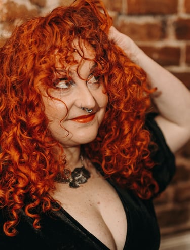 woman with ginger/copper curly hair