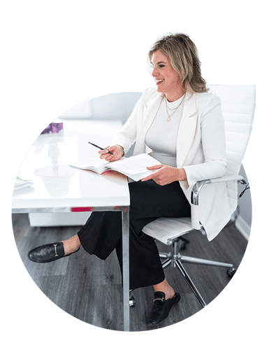 Mallory Powell, psychologist - sitting at her desk
