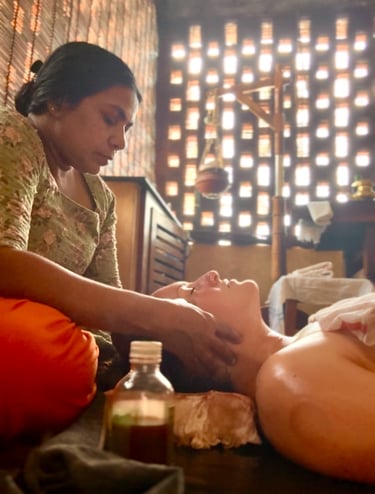 a picture of Alena Booth, founded of Grateful Minds during her Panchakarma in India, head massage