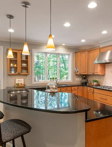 a clean kitchen with a large island and a bar stool