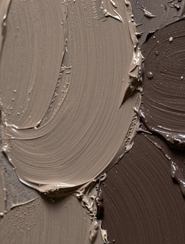 Macro photography of an artist's canvas showing thick, impasto brushstrokes of taupe and dark brown paint. The lighting emphasizes the texture and physical depth of the art. Sophisticated and professional aesthetic with a curated feel.