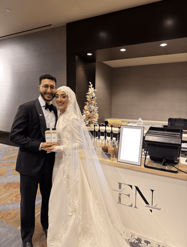 Bride and groom holding custom bottled coffee drinks at Dallas wedding with mobile coffee cart