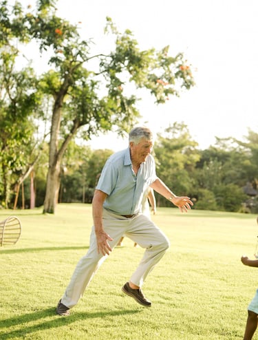 grandfather playing and running with his grandchildren on the lawn at rimba by ayana bali a candid family photography moment