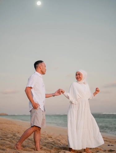 Ilham family walking together along Melasti Beach Bali during a calm sunset family session