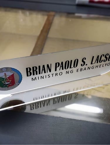 Frosted acrylic desk nameplate with church emblem.