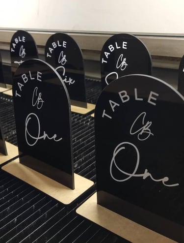 Black Table Numbers oval shaped with text saying Table and the numbers