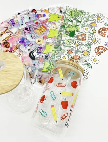 bunch of DTV UV stickers and 2 Soda jar with 1 full decorated stickers