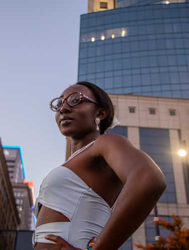 A woman posing in the midst of a skyscrapper