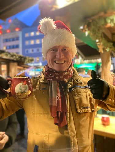 Man drinking a feuerzangenbowle at the Heinzelmannchen Cologne Christmas Markets