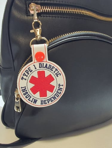 medical alert tag attached to a bag for type 1 diabetes
