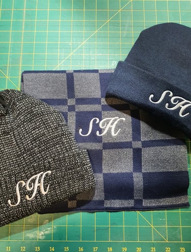 customers hats and scarf embroidered with their initials