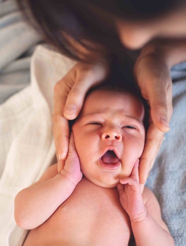 a baby is being held by a woman