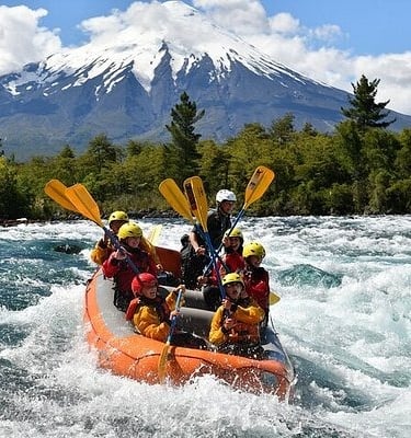 a group of people on raft raft rafting down a river in chile