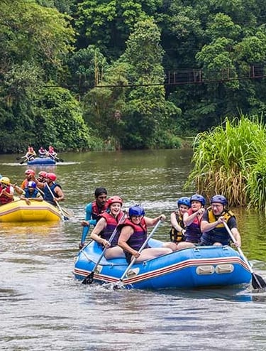 a group of people on raft raft rafting down a river in sri lanka