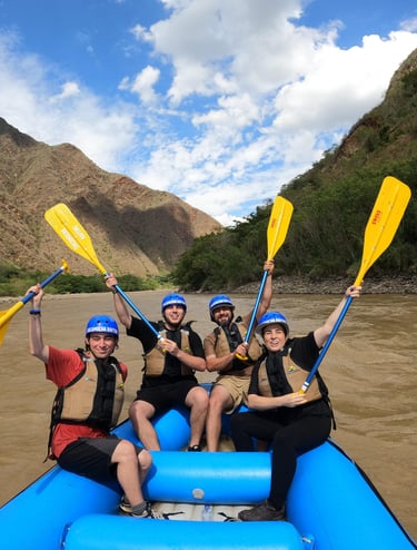 a group of people on raft raft rafting down a river in colombia