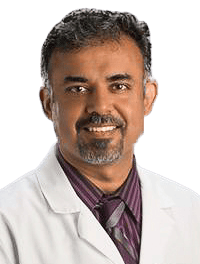 man wearing a white lab coat and button down shirt