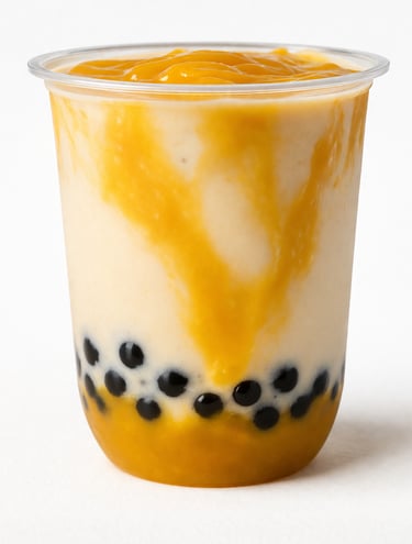 Mango bubble tea smoothie with black tapioca pearls and fruit puree in a clear plastic cup.