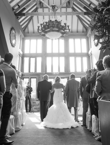 bride and groom at the alter