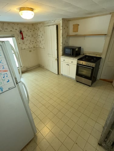 Junk removal truck loaded with appliances ready for disposal