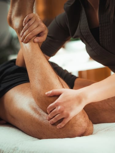 a man is getting a sports massage from a female massage therapist