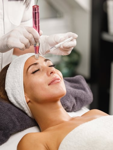 Esthetician performing a PRP treatment to a female client