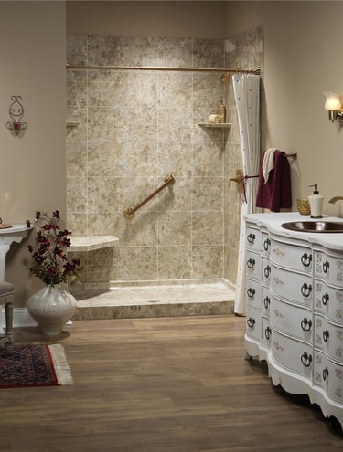 Elegant tile shower with built-in seat and grab bar installed by Toledo New Bath.