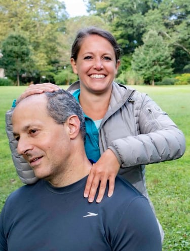 a man and woman smiling and posing for a picture