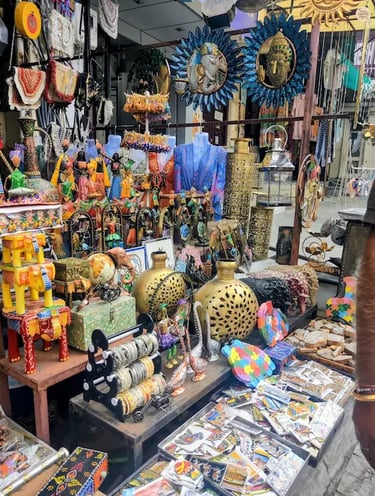Souvenir shop in bapu bazar Udaipur displaying colorful local crafts and handmade items.