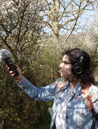 Federica doing some field recording in a forest