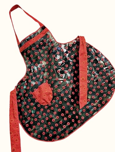 Apron made using film and red buttons as fabric. It is styled after my grandmother’s apron make from