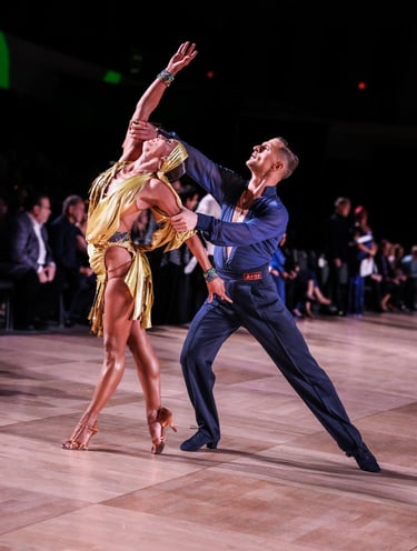 a dance couple posing at the competition