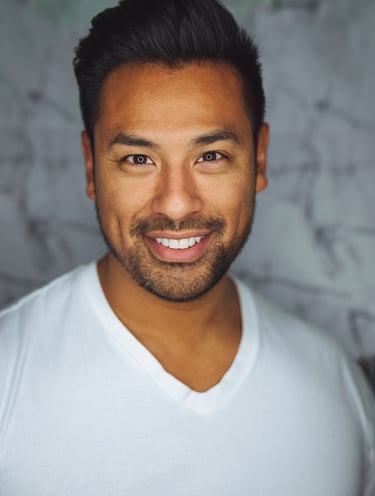 a man with a beard and a white shirt