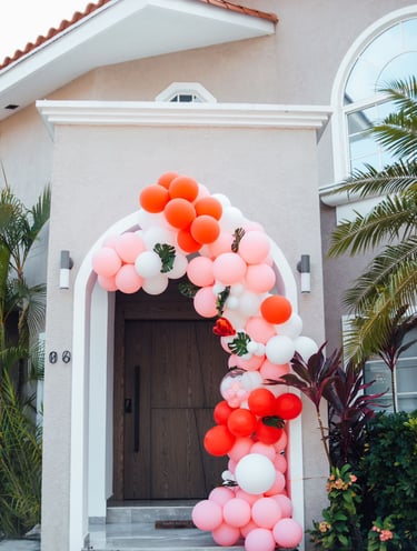 a colorful arch shaped balloon - shaped arch with balloons