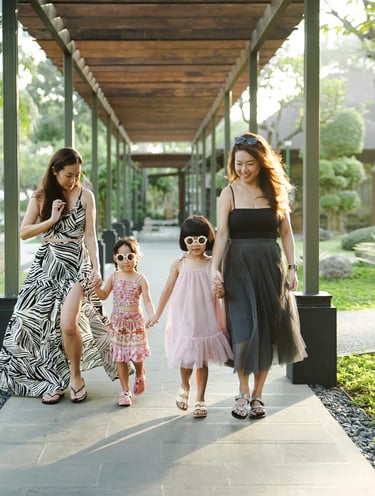 Family walking together at Padma Resort Legian Bali during natural and relaxed lifestyle photography session.
