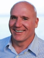 a man in a blue shirt and a white shirt