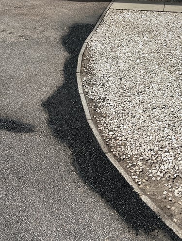 “Close-up of crack repair on a tarmac surface during restoration”
