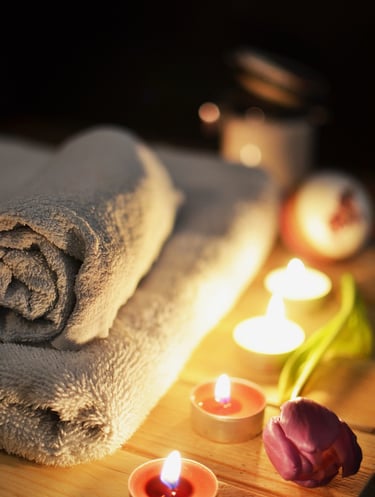 a towel on a table with candles and candles