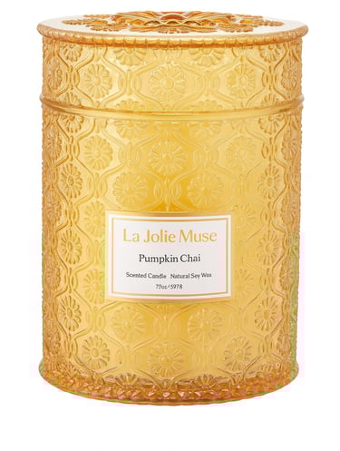 A matte orange ceramic candle jar with a matching lid, captured in clear details