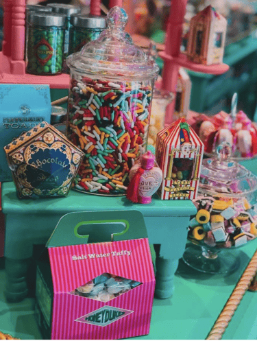 a table with a lot of candy and candies