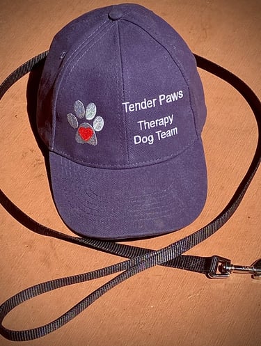 Blue Tender Paws Therapy Dog Team cap with a leash.