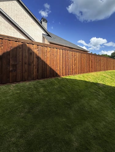 new fence freshly installed and stained