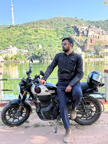 Traveler posing by Nawal Sagar Lake with Taragarh Fort rising in the backdrop, Bundi.