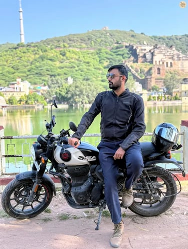 Traveler posing by Nawal Sagar Lake with Taragarh Fort rising in the backdrop, Bundi.