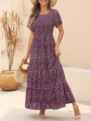 floral maxi dress featuring a round neck, flutter short sleeves, and a smocked bodice 